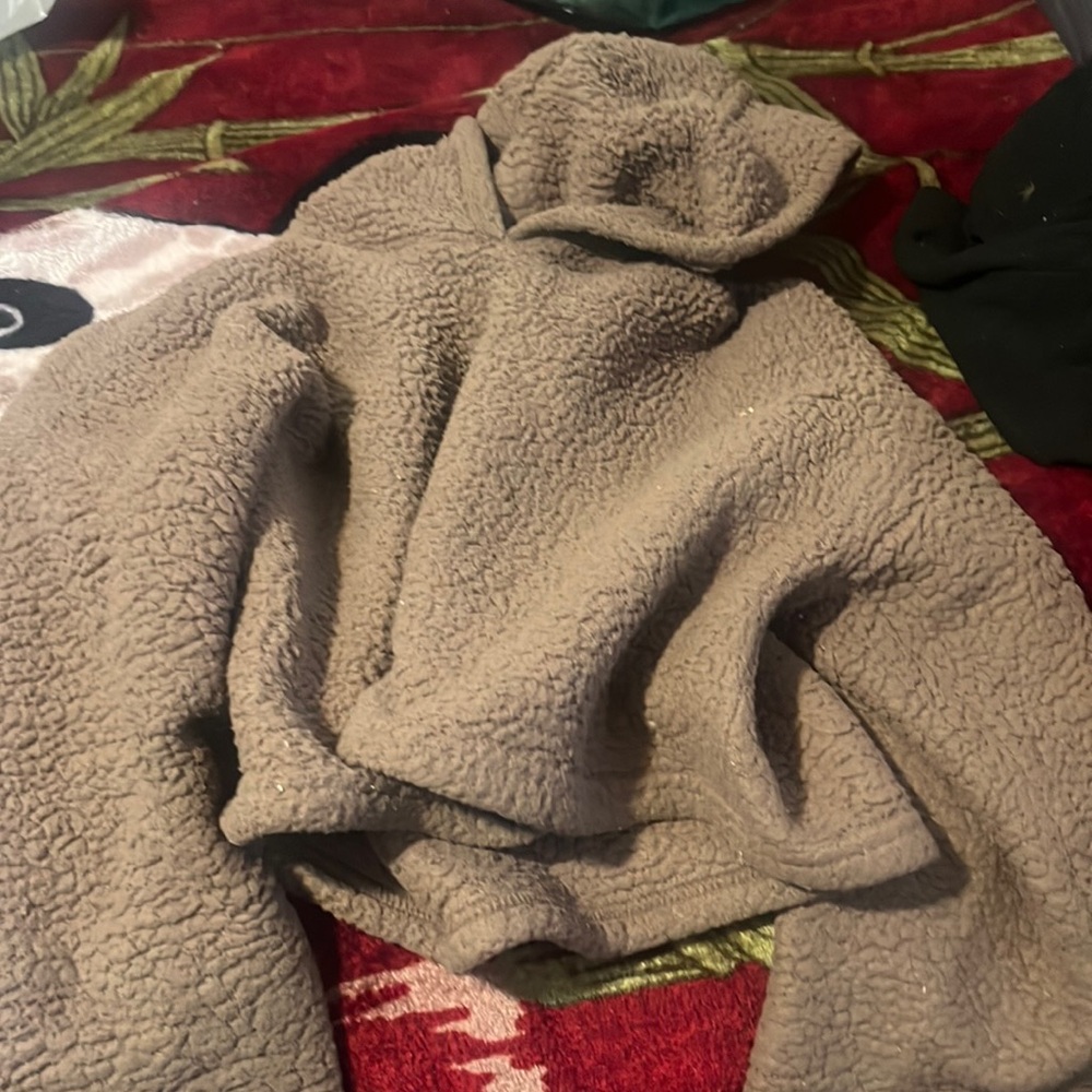 I’m selling a fur brown sweater hoodie near the brand it’s called unknown